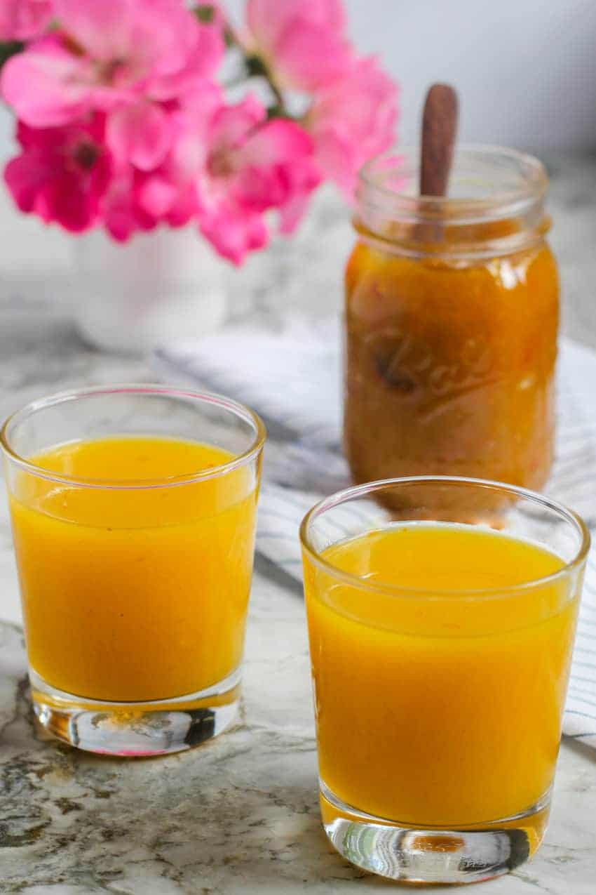 two glasses of aam panna and jar of mango jam
