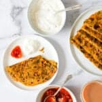 methi thepla served with pickle and yogurt