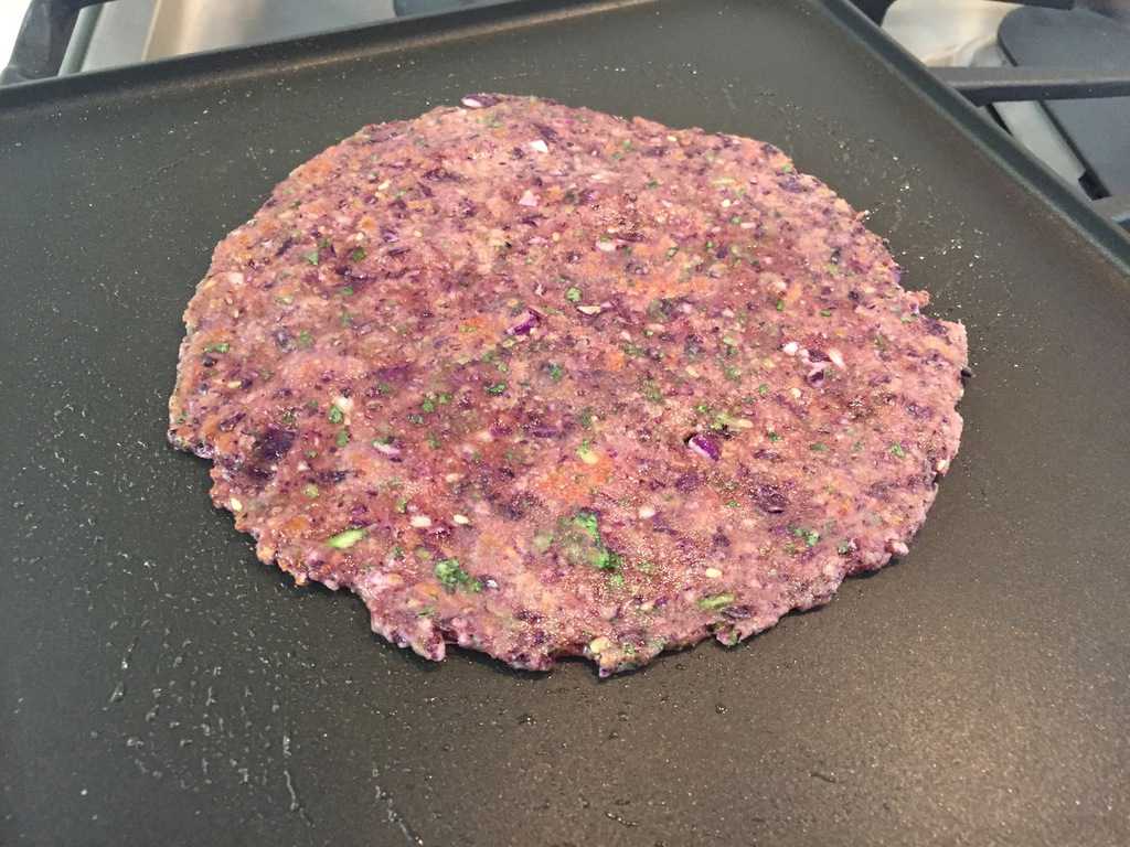 Cooking Cabbage Paratha on a pan 