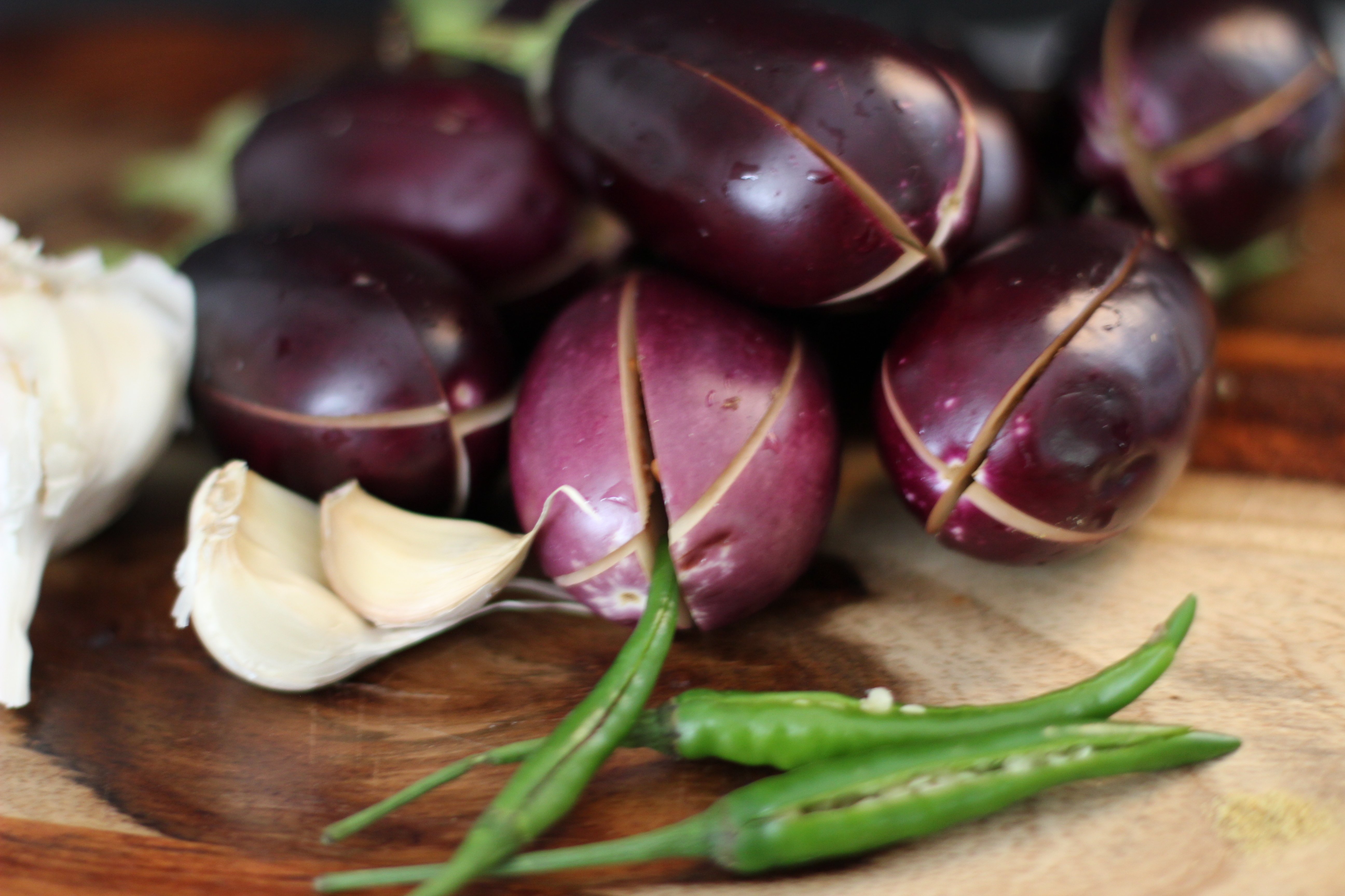 sliced baby eggplant and green chilies 