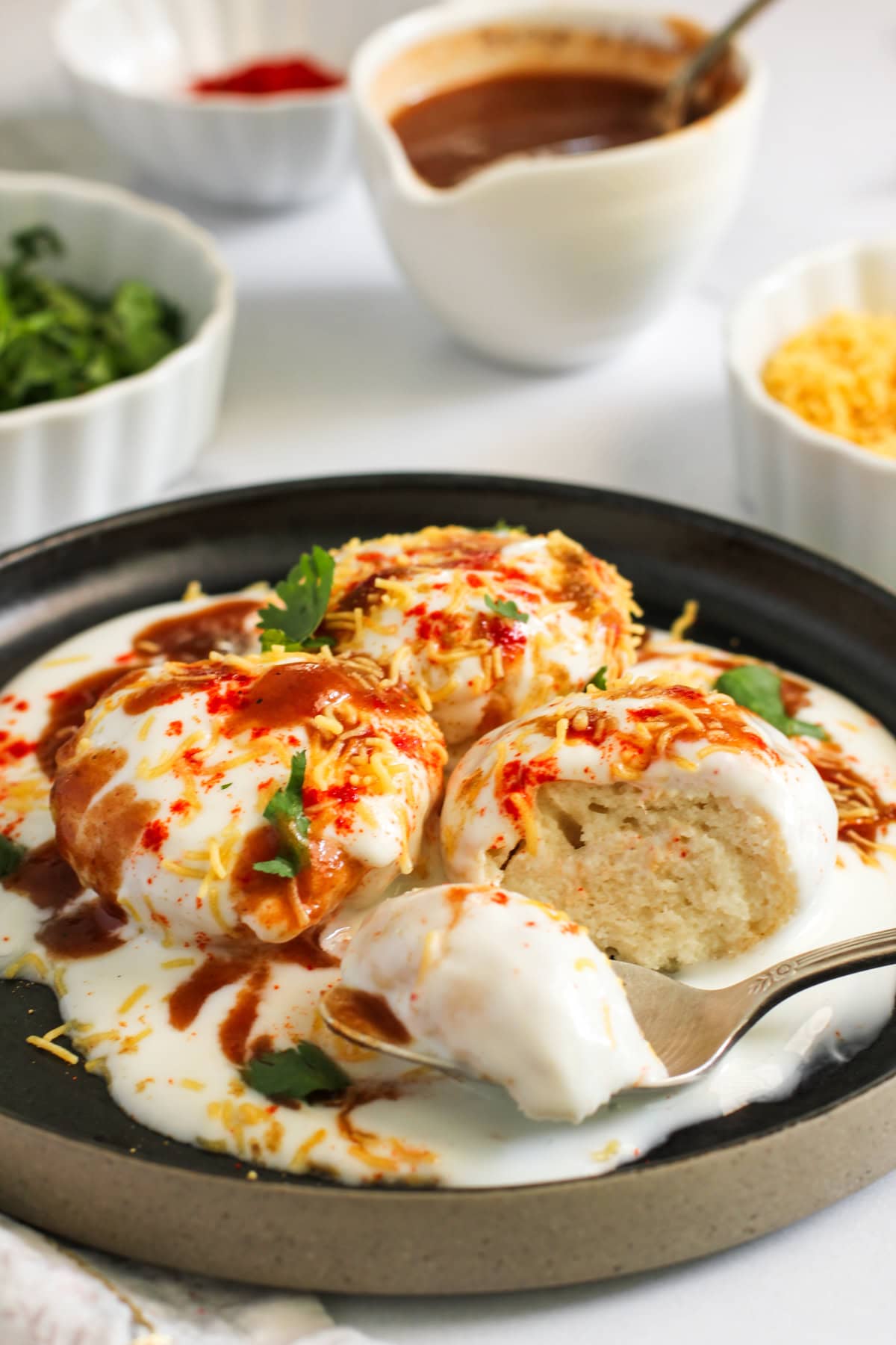 bite shot of Dahi Vada showing spongy inside texture