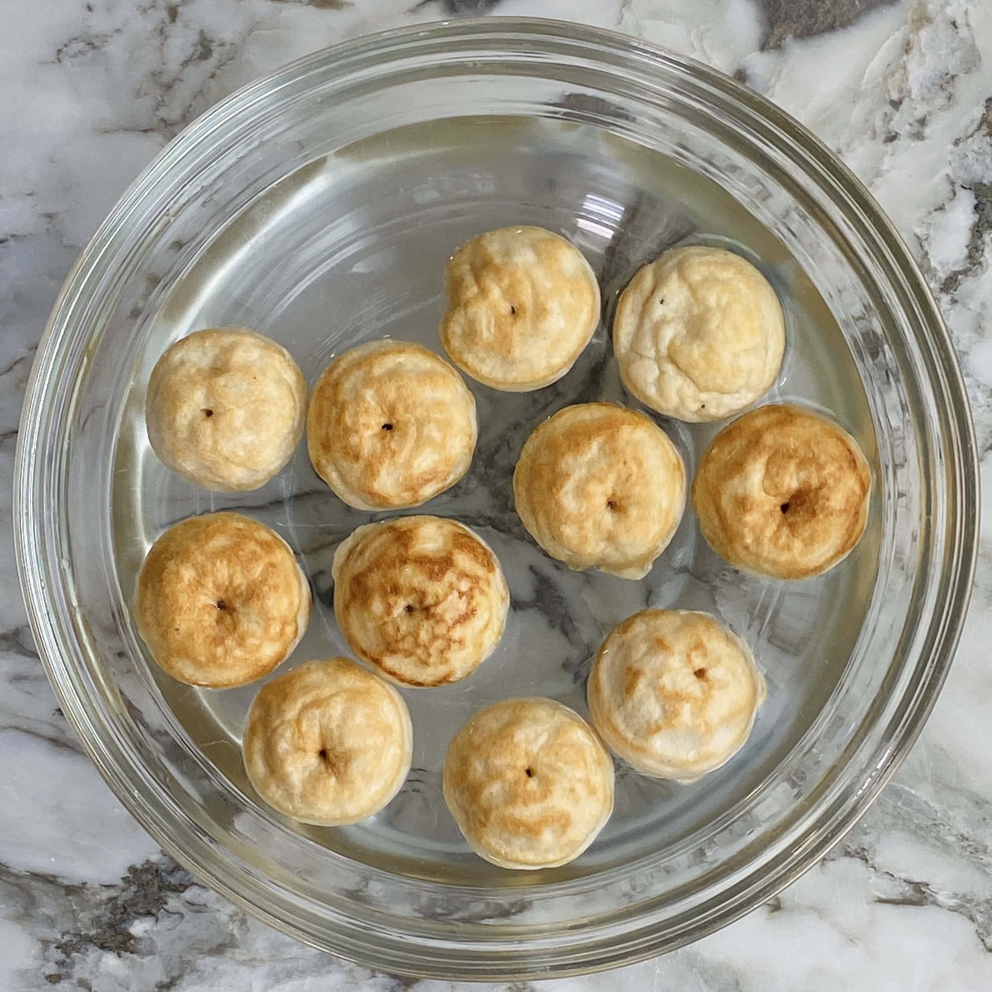 dahi vada soaking in water 