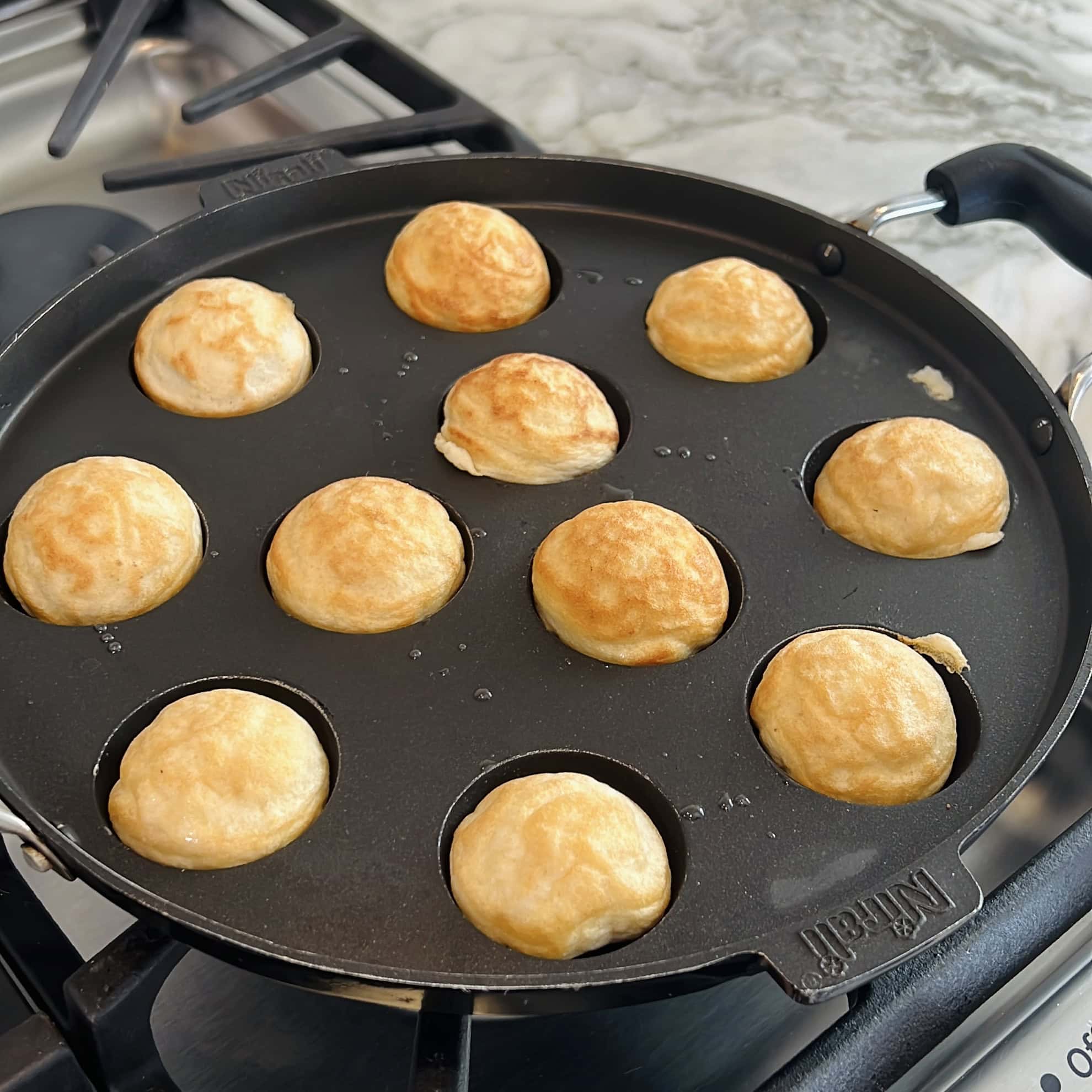 paniyaram pan with cooked dahi vadas 