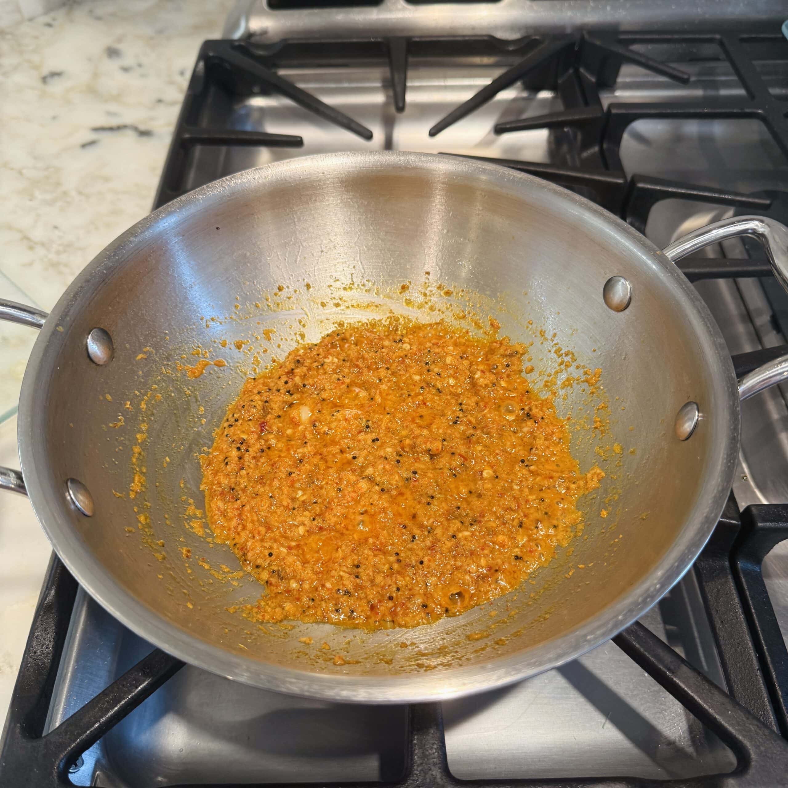 spice paste sauteed in a pan 