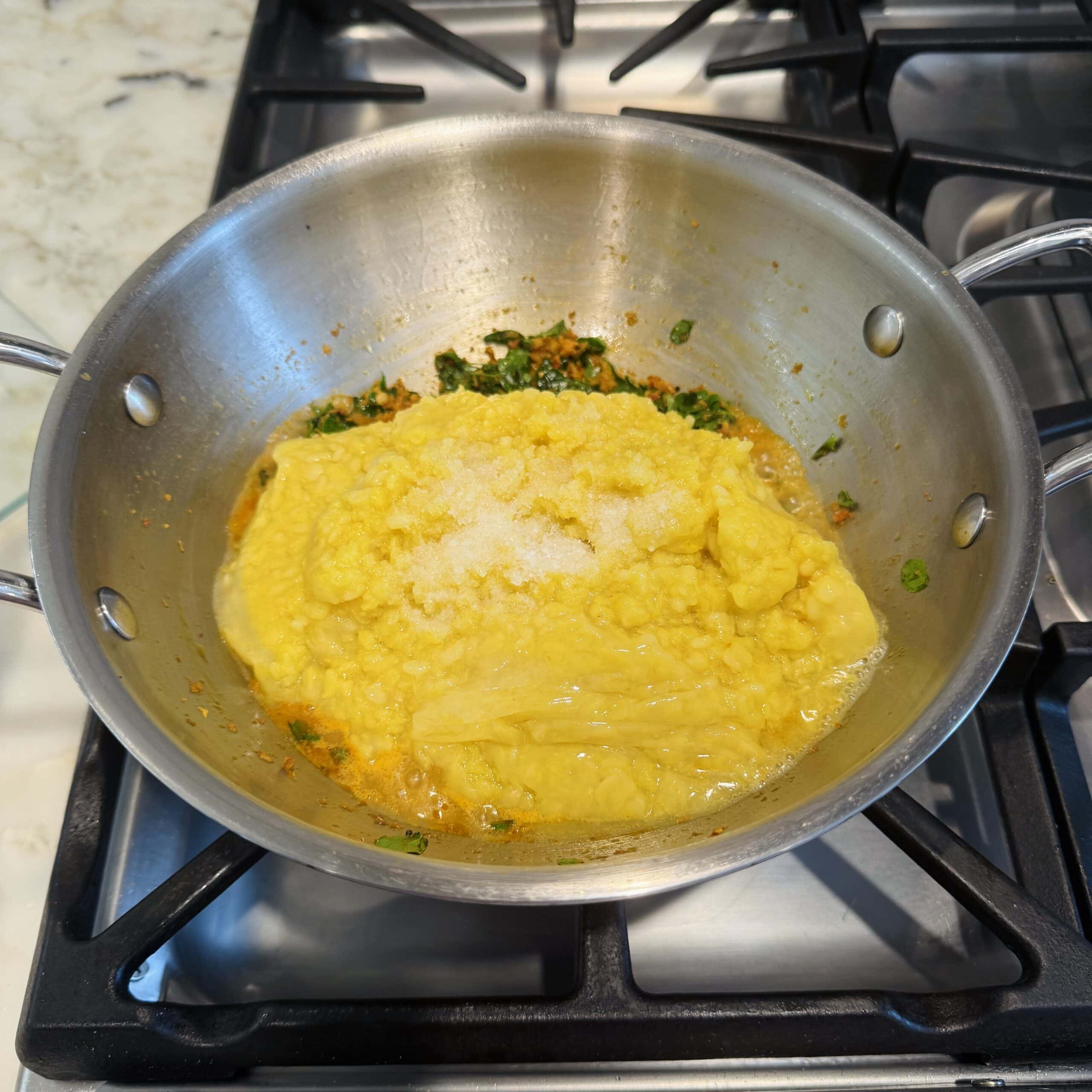 cooked lentils and salt added to pan 
