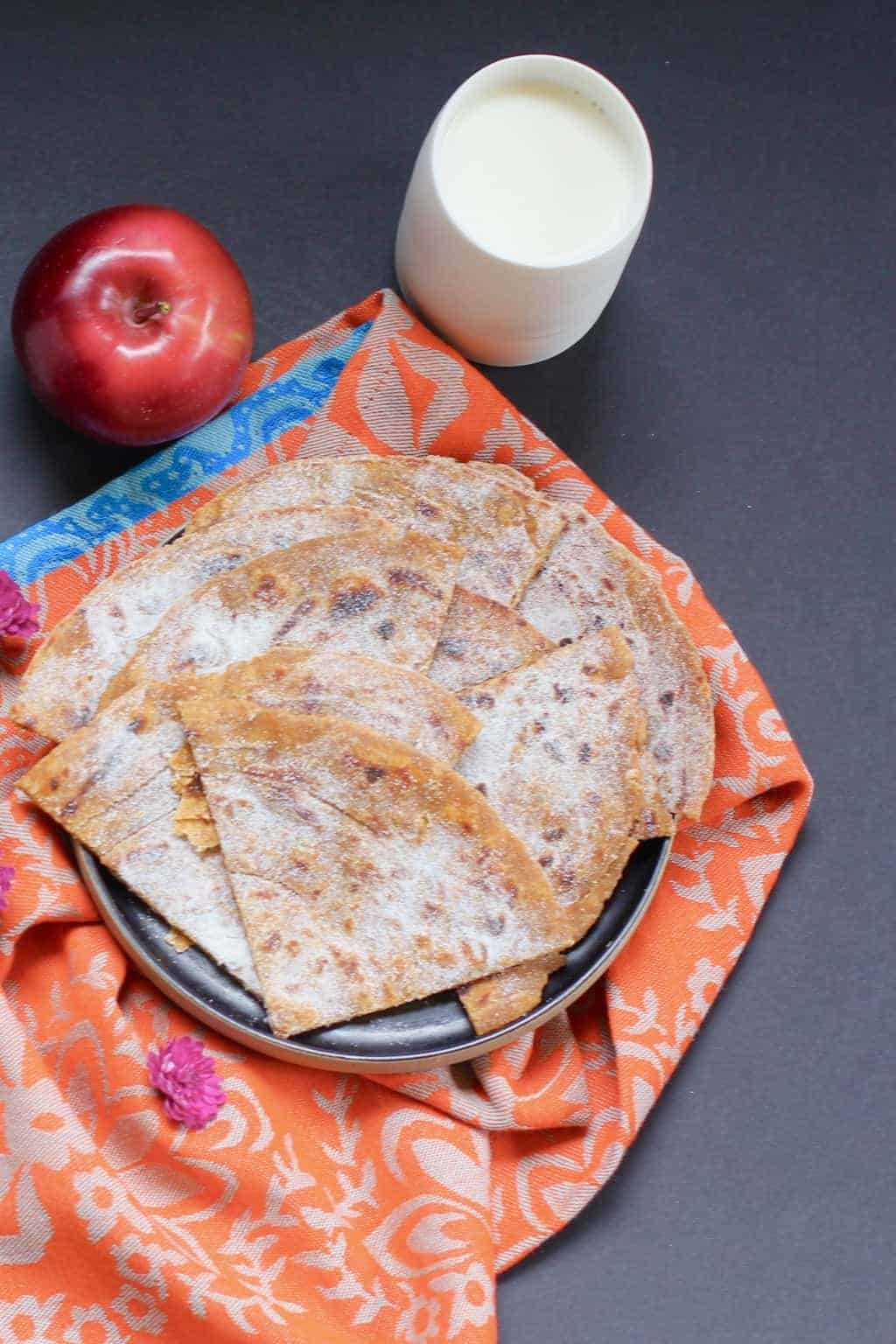 Pumpkin Parathas sprinkled with powdered sugar