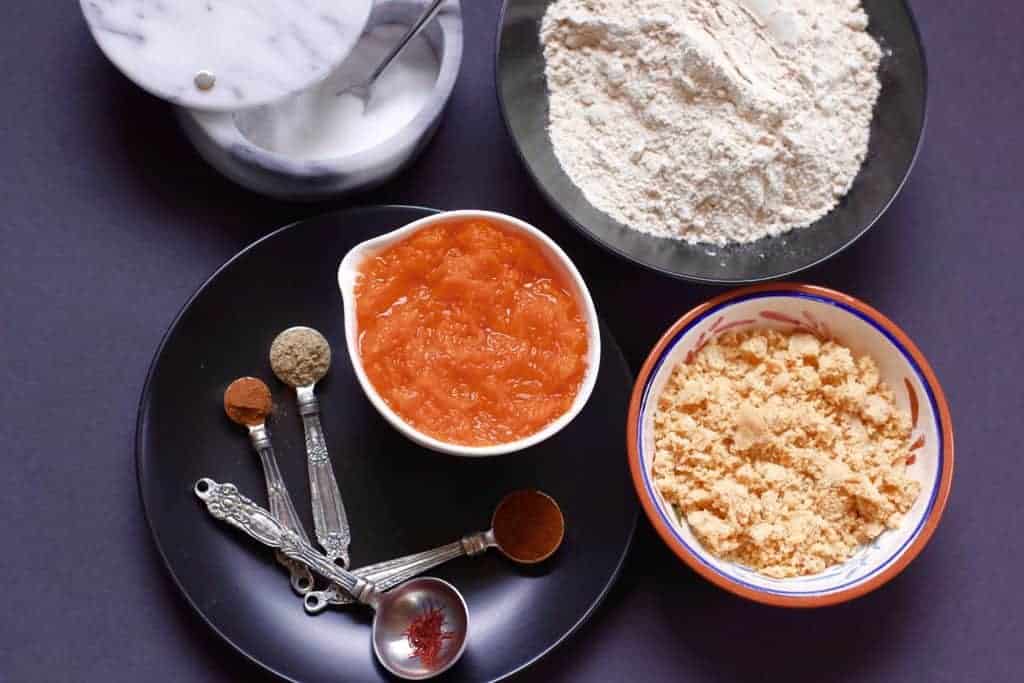 ingredients for pumpkin parathas - whole wheat flour, pumpkin puree, spices and jaggery