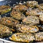 Pan fried Aloo Vadi with sesame seeds on top