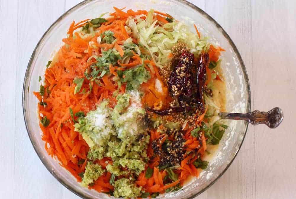 Bowl with the ingredients mixed for handvo