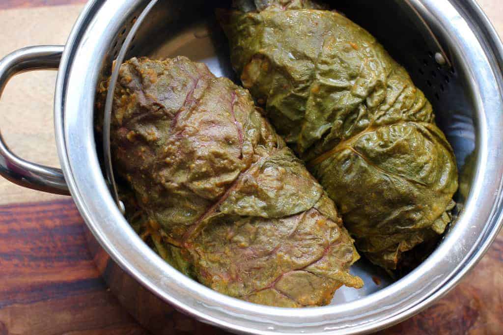 Steamed swiss chard rolls in a steamer basket