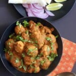 chicken kofta curry in a black bowl