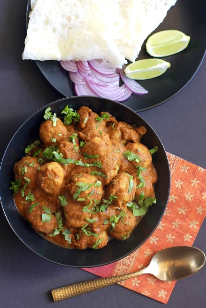 chicken kofta curry in a black bowl