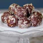 quinoa almonds date truffles stacked on a cake stand
