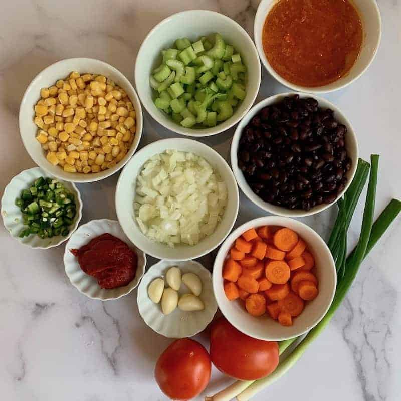 Ingredients for Buffalo Chicken Chili in bowls 