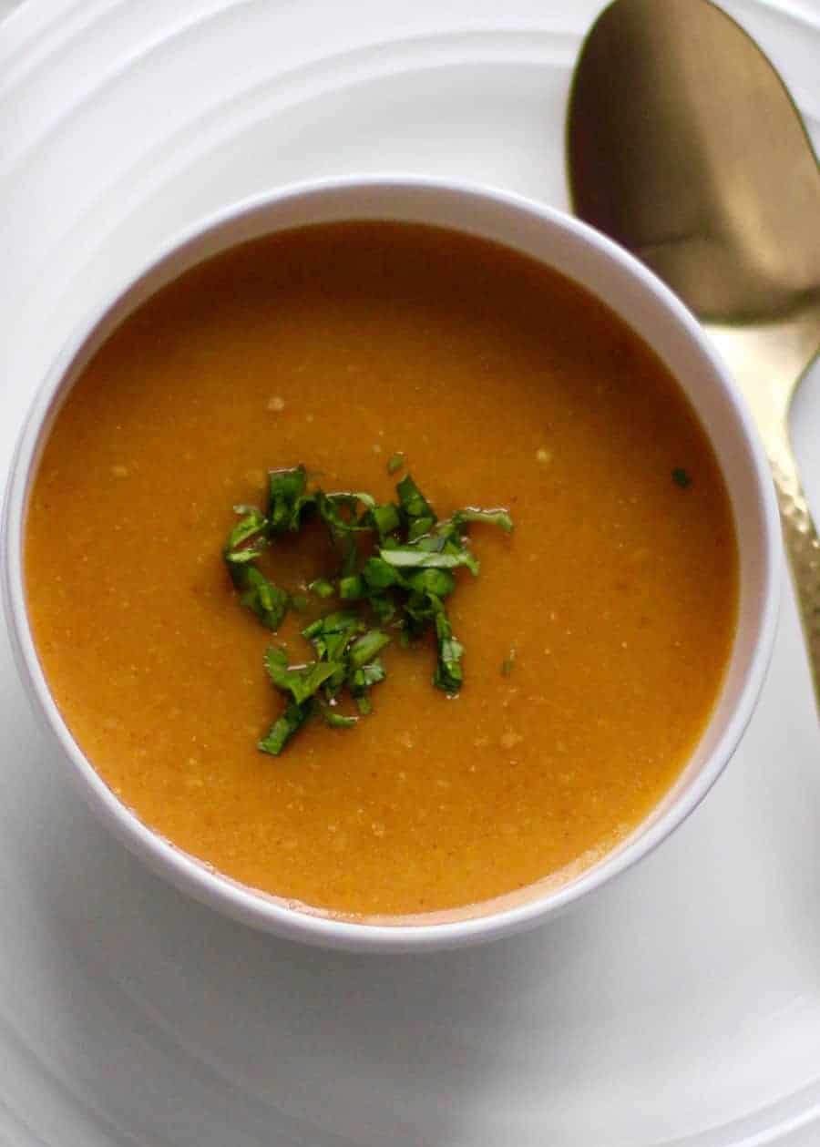 citrusy lentil soup in a white bowl