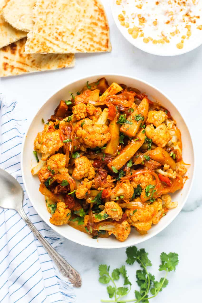 Aloo Gobhi served with naan and raita 