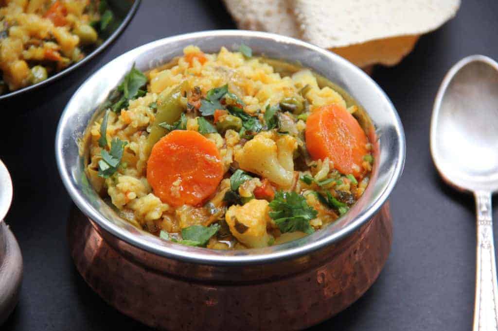 Serving bowl with mixed lentils and vegetable khichdi 