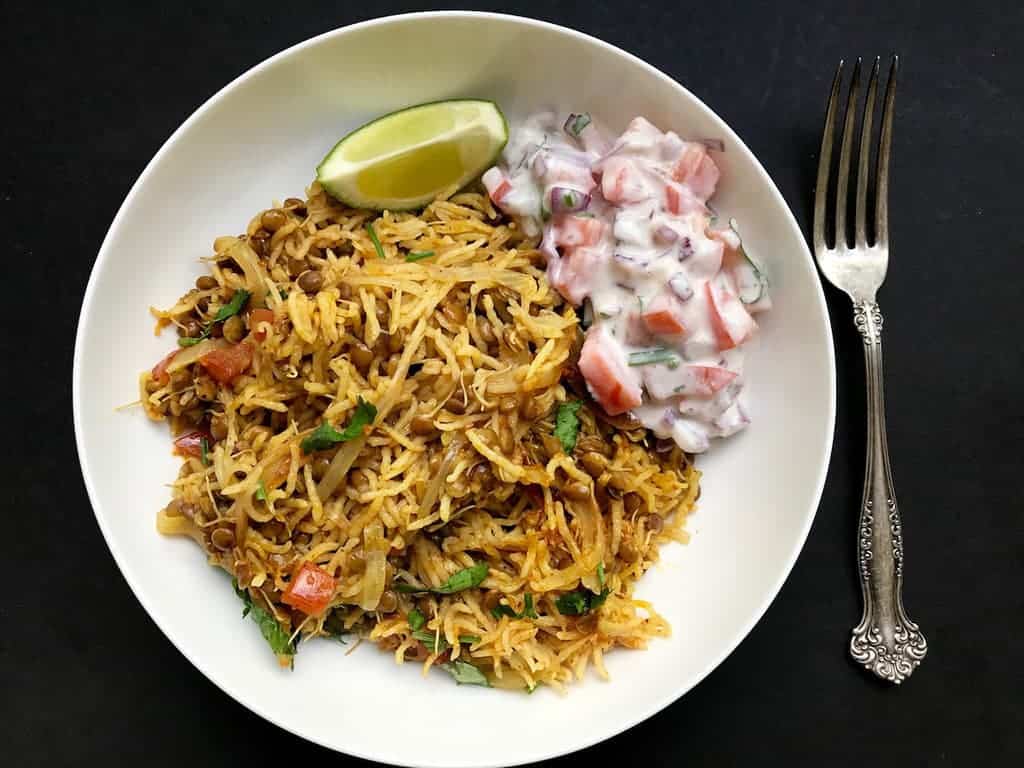 sprouted lentils khichdi in a white bowl