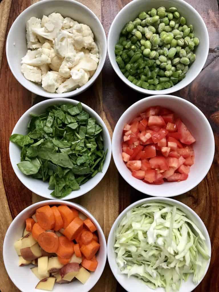 Bowl with vegetables used in mixed lentils khichdi recipe