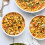 Corn Poblano chowder in 3 white bowls