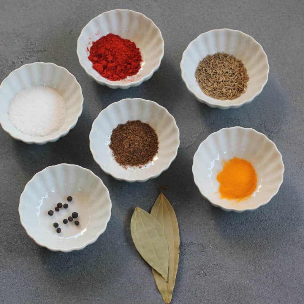 Shrimp Biryani spices in small white bowls