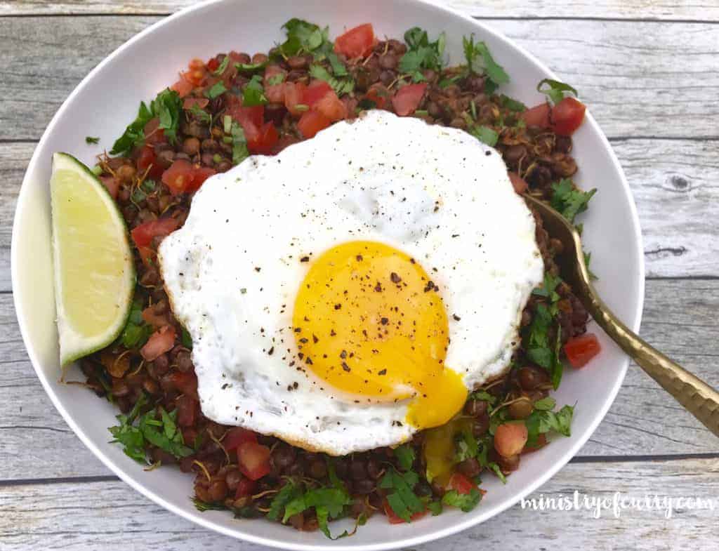 sprouted lentils breakfast bowl with fried egg 
