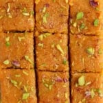 mango burfi garnished with pistachios and saffron