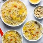 3 bowls of sweet coconut rice with garnish ingredients on the side