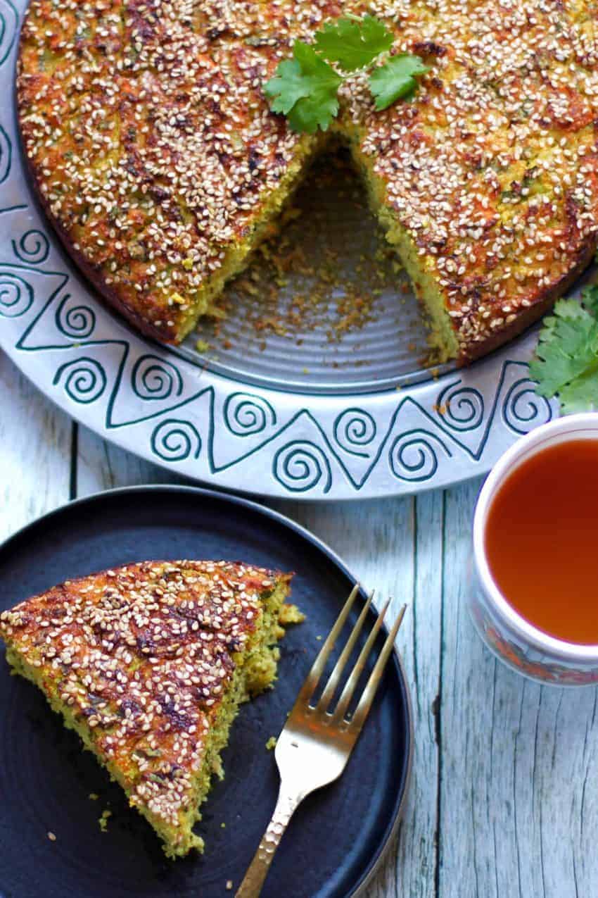 Piece of handvo in a plate with tea 