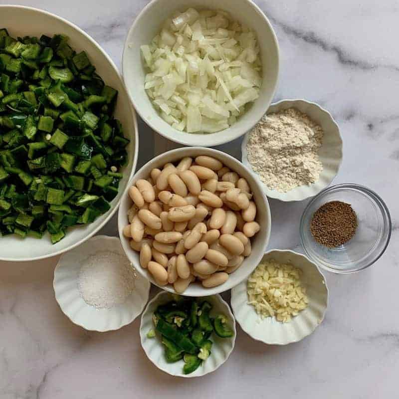 ingredients in white bowls for white chicken poblano chili