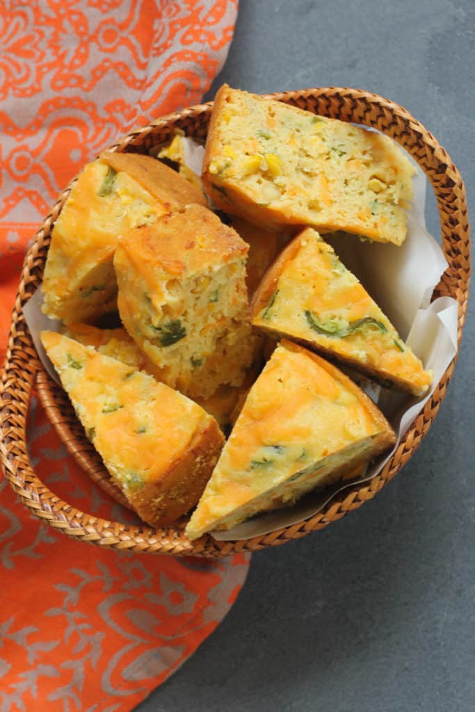 Jalapeno Cheddar Cornbread Sliced in a wicker basket