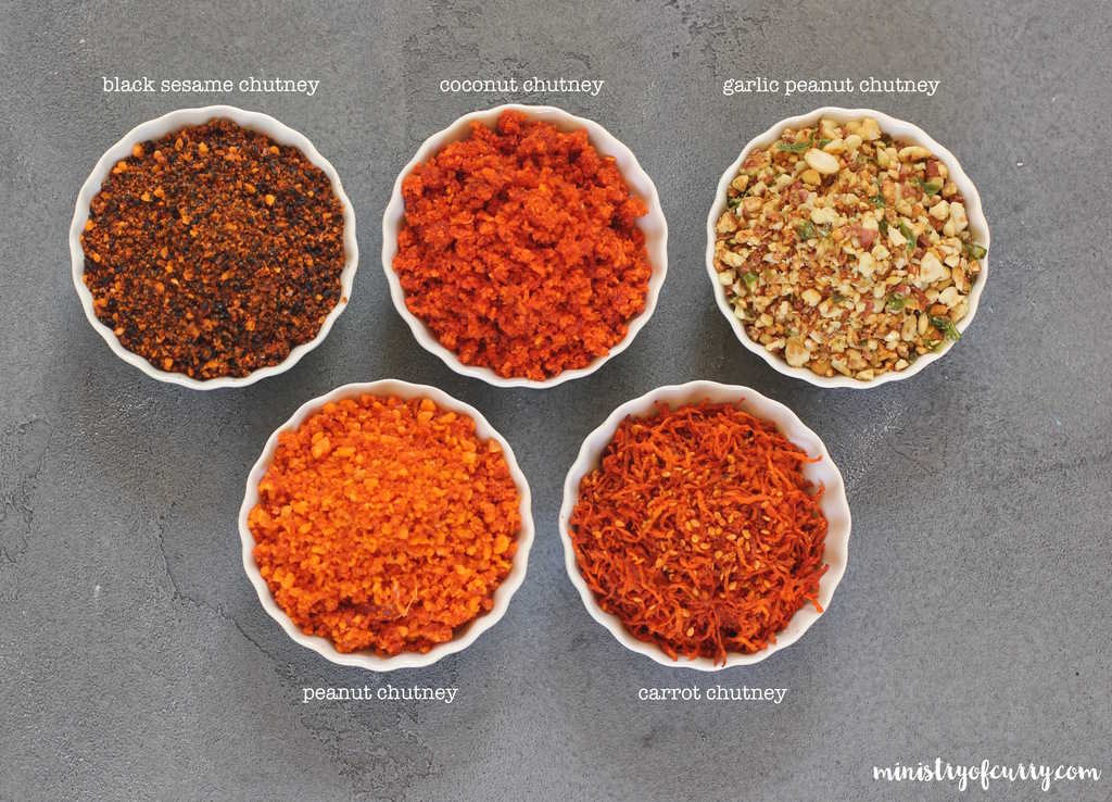 five dry chutney in small white bowls