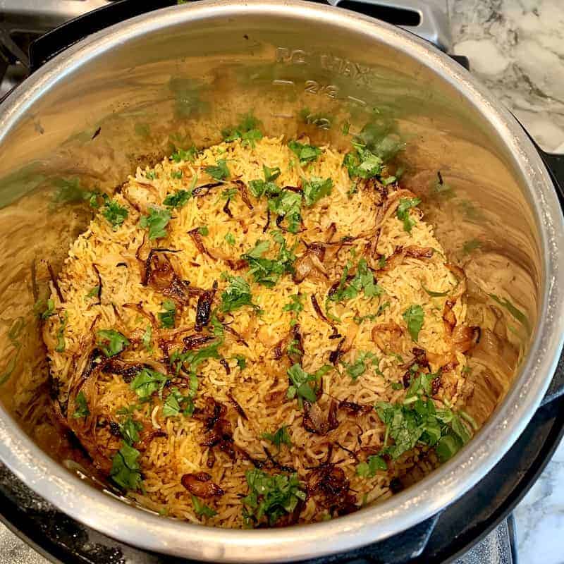 chickpea biryani garnished with caramelized onions