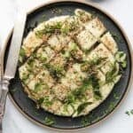 rava dhokla in a black platter