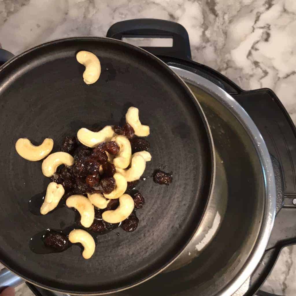 photos showing cashews and raisins fried to garnish on korma 