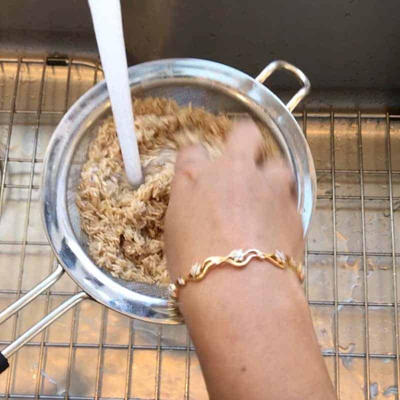 rinse rice in a strainer 