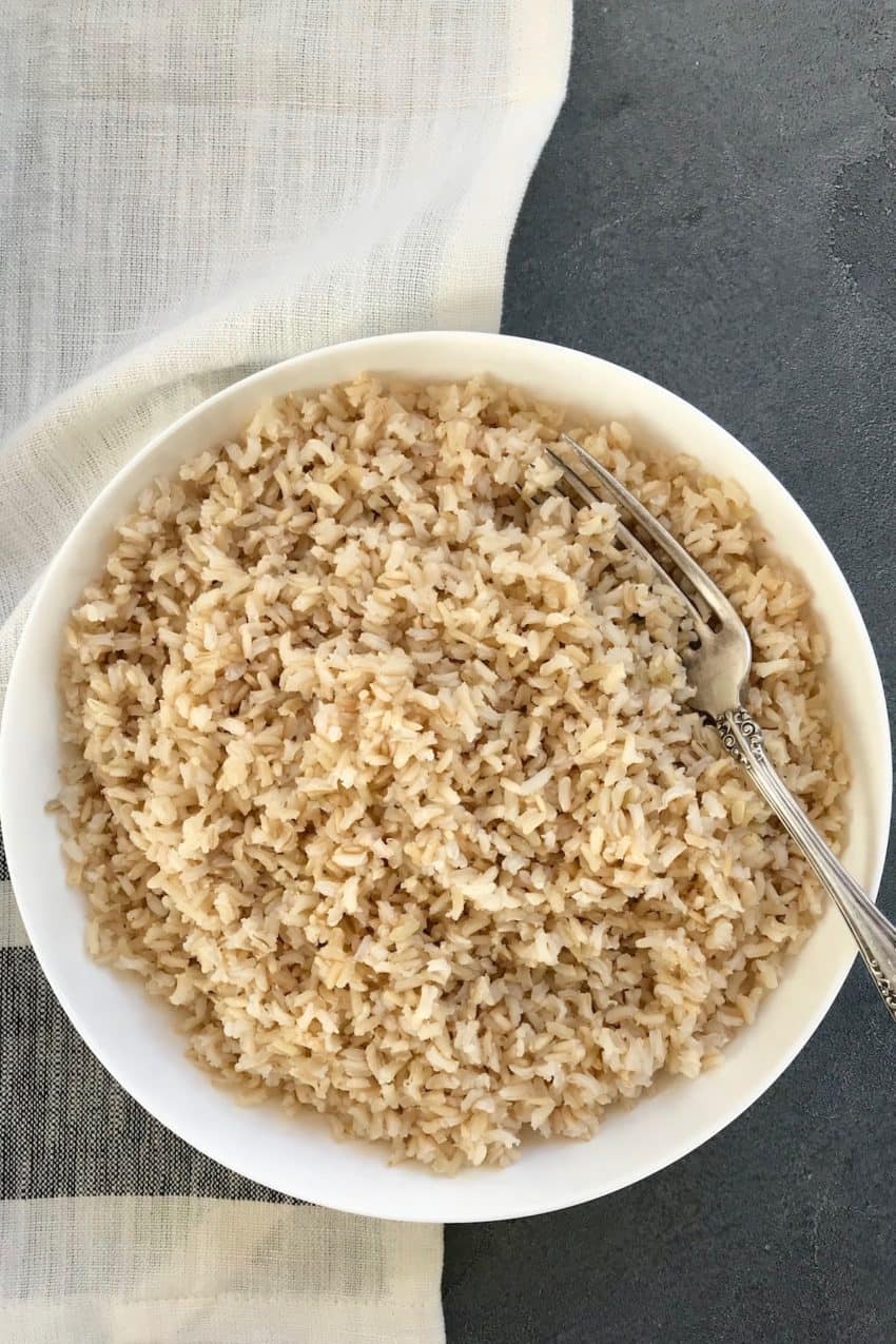 Cooked brown rice in a white bowl