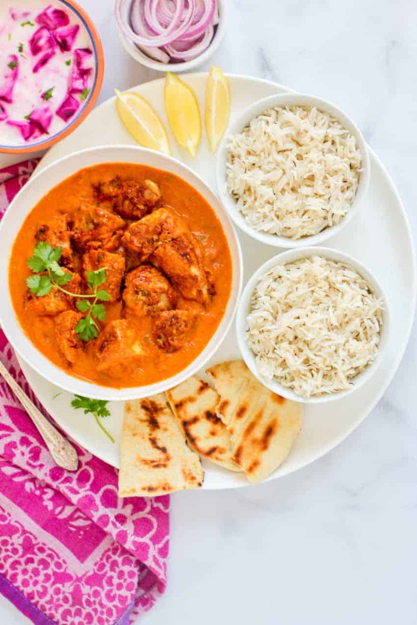 Large platter with chicken tikka masala, rice and naan