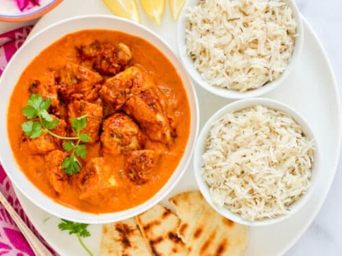 chicken tikka masala served with rice and naan