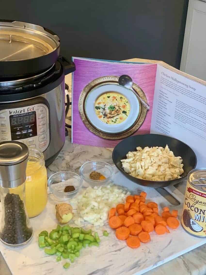 ingredients for Chicken Mulligatawny Soup on a cutting board 