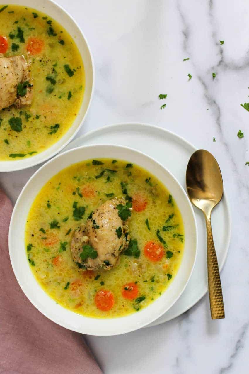 photo of chicken mulligatawny soup served in 2 white bowls