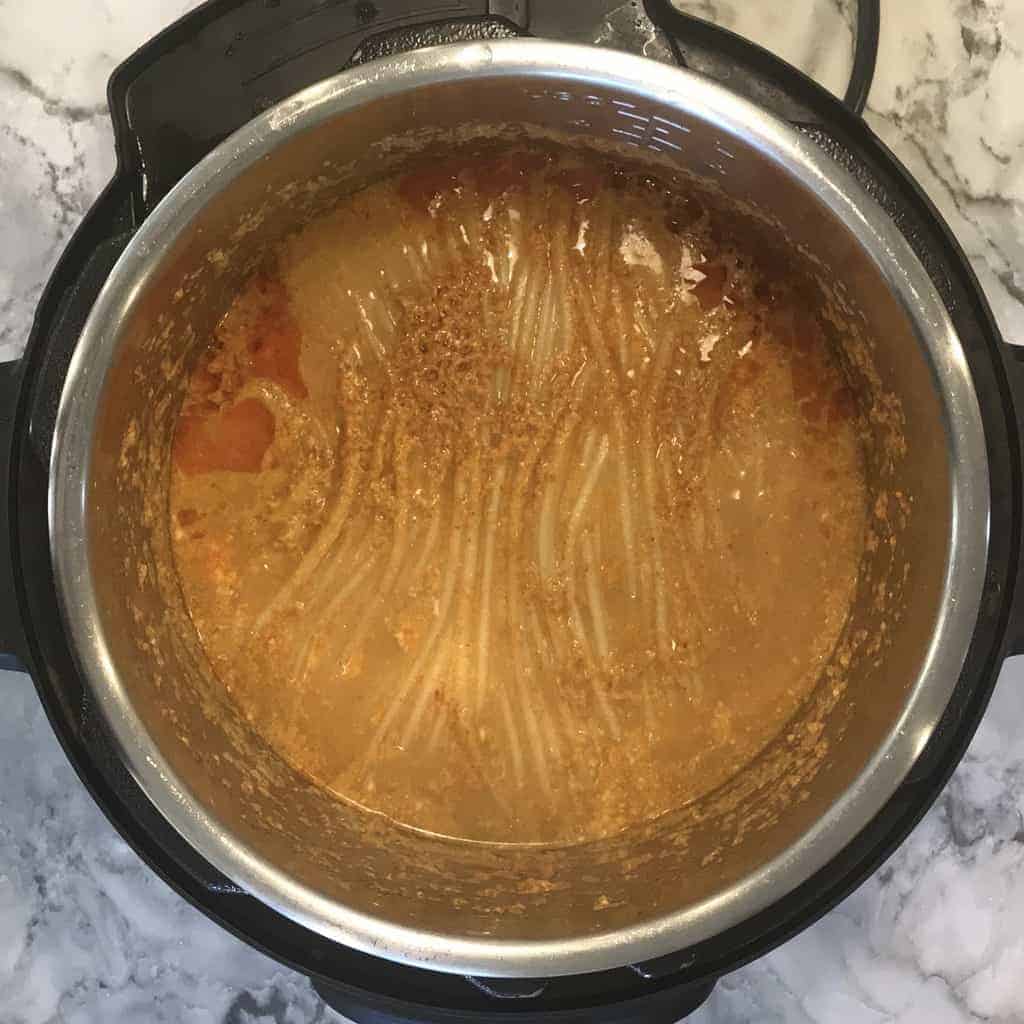 Instant Pot with cooked noodles in coconut curry