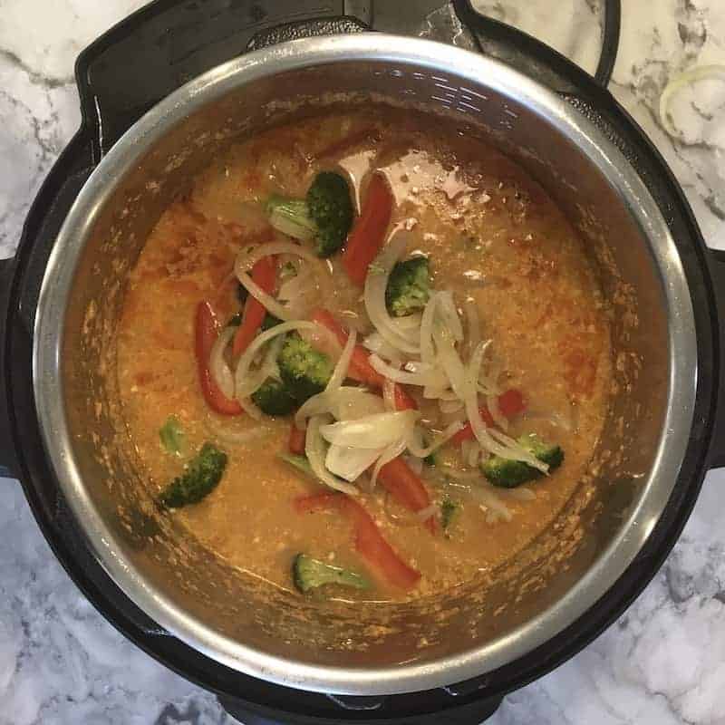 Instant Pot with added sauteed veggies to the cooked noodles