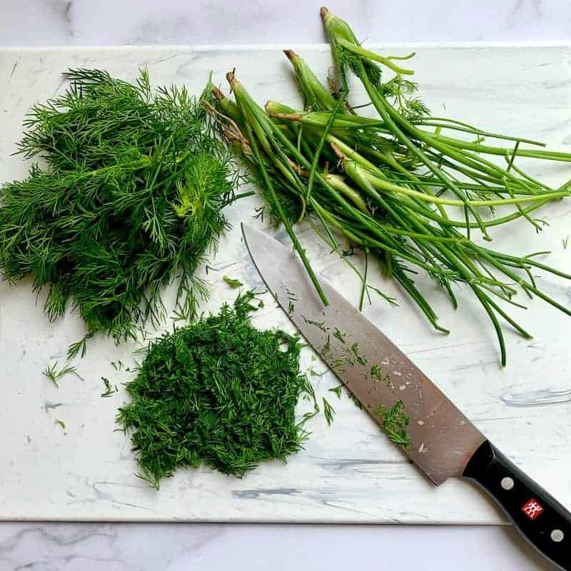 Fresh Dill chopped on a cutting board