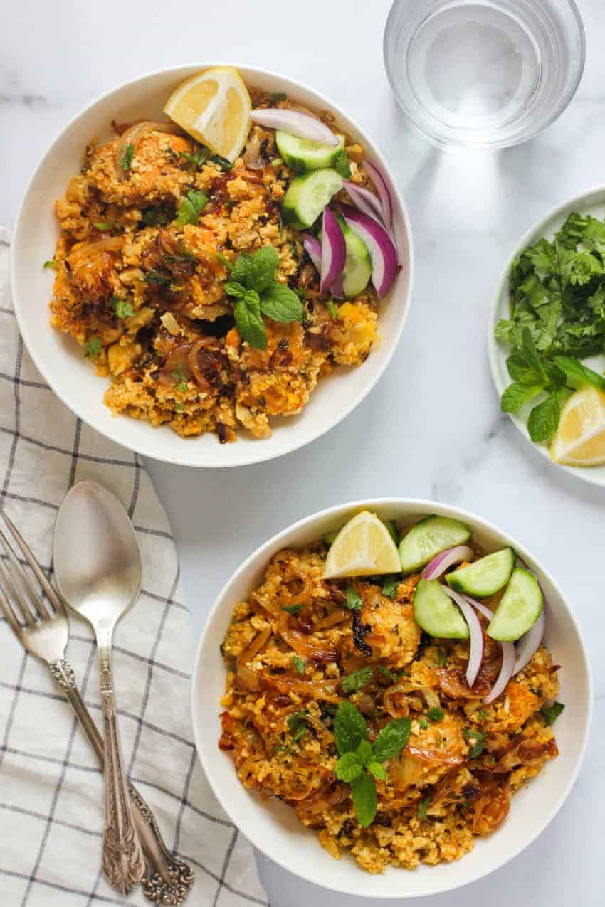 Cauliflower rice chicken biryani in two bowls
