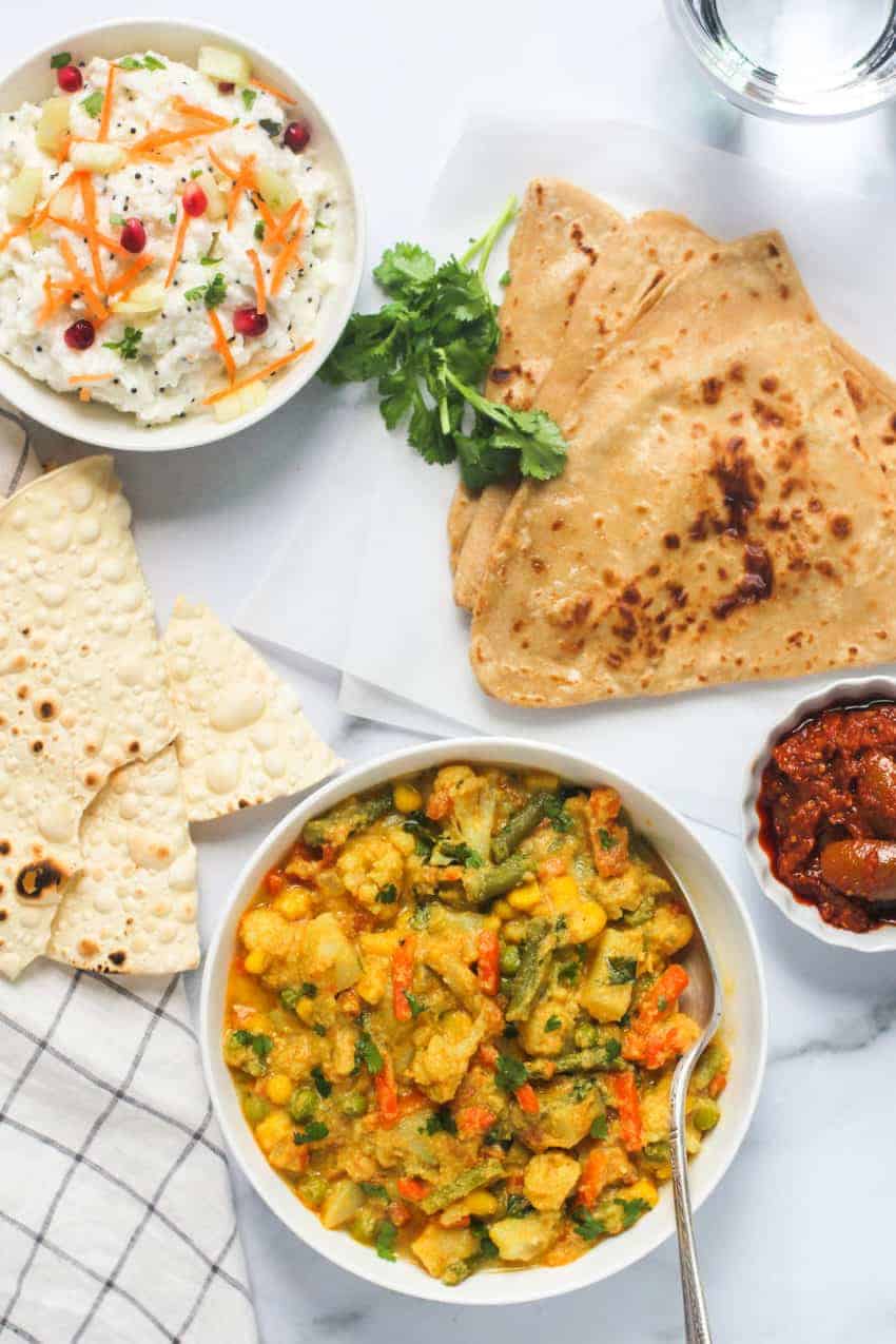 vegetable kurma served with curd rice and parathas