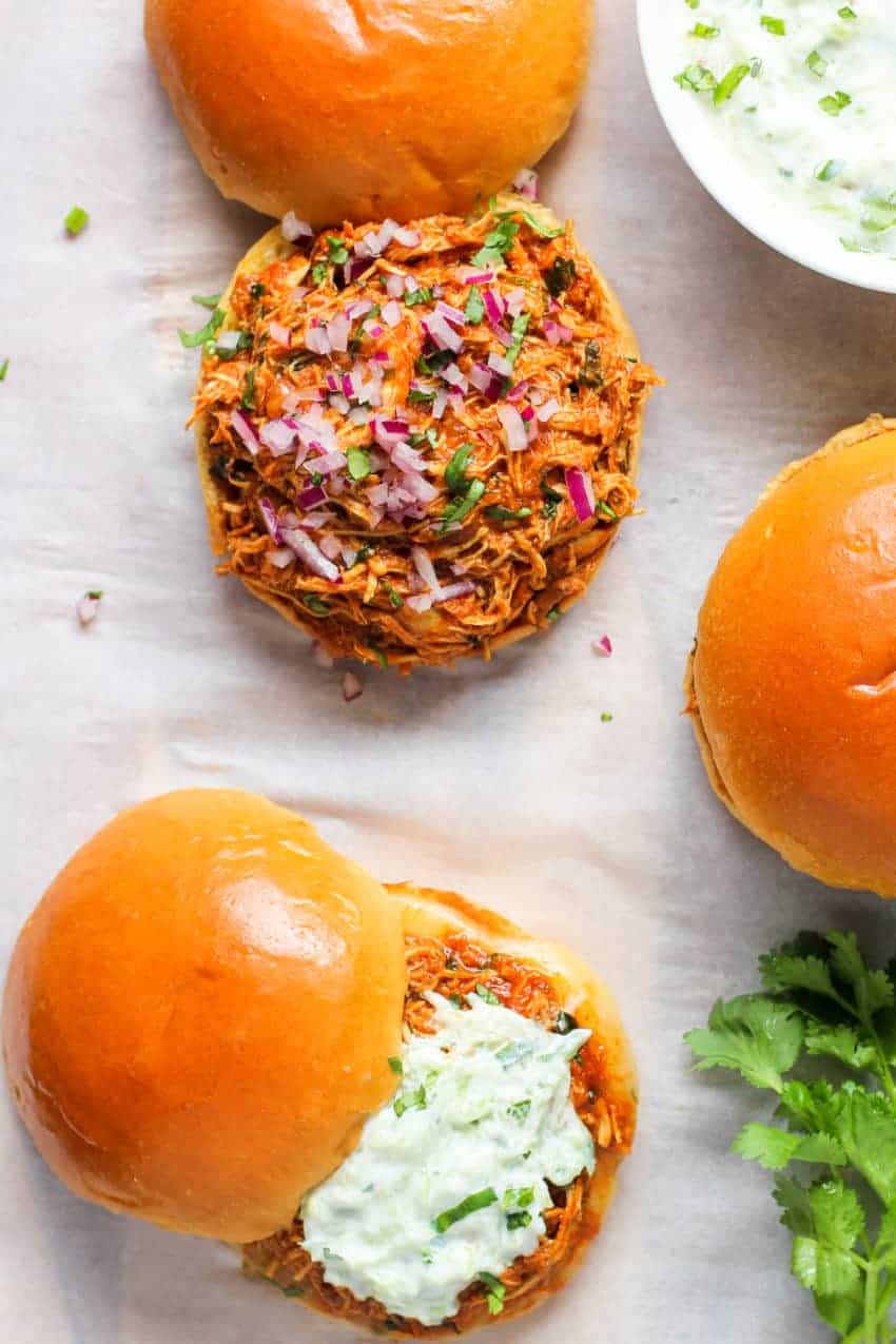 Pulled chicken sandwich served with cucumber raita