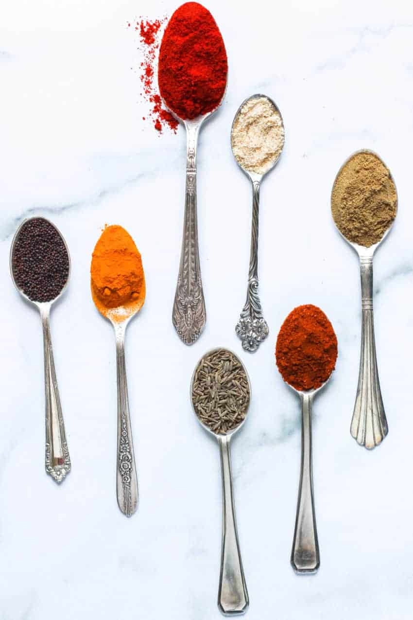Indian spices displayed in spoons 