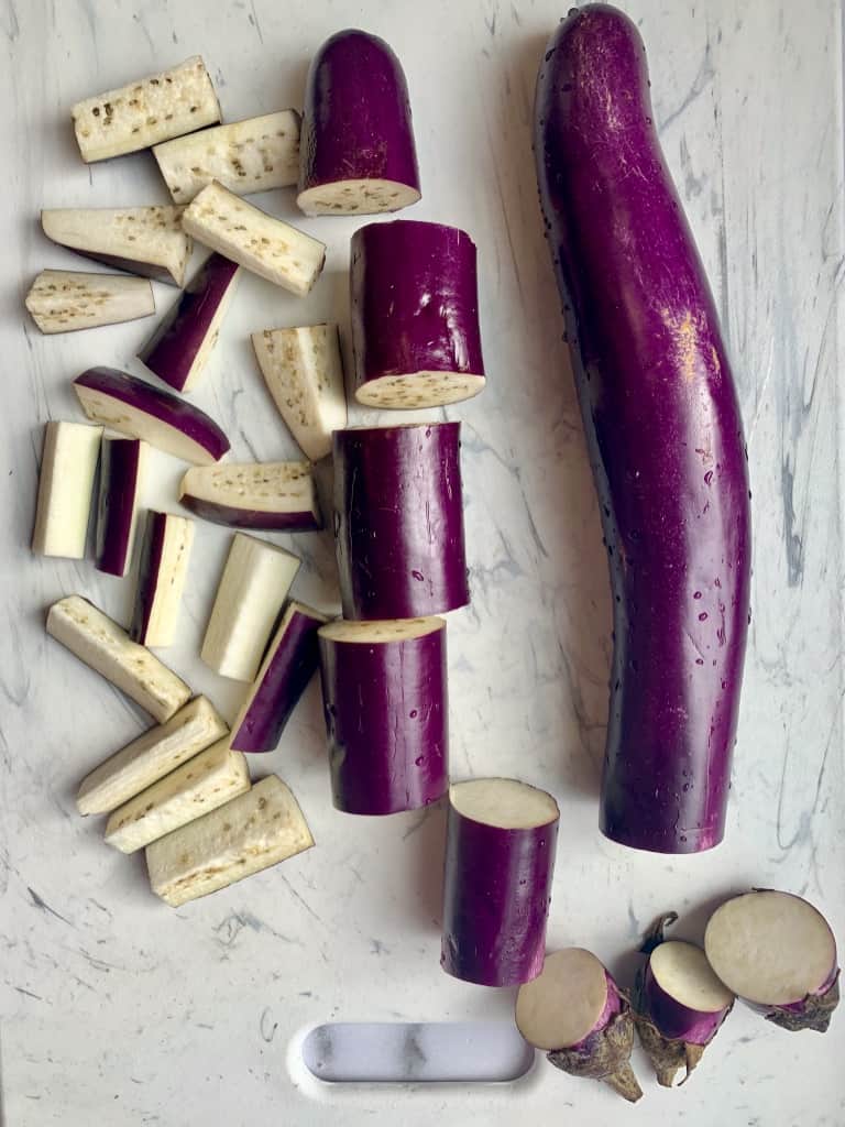 chinese eggplant cut on a cutting board