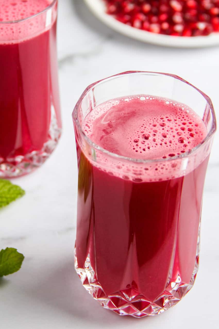 homemade pomegranate juice served  in a glass 